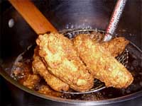 Taking the Chicken Wings out of the Fryer, Picture
