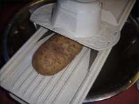 Slicing the Potatoes on a Mandolin Picture